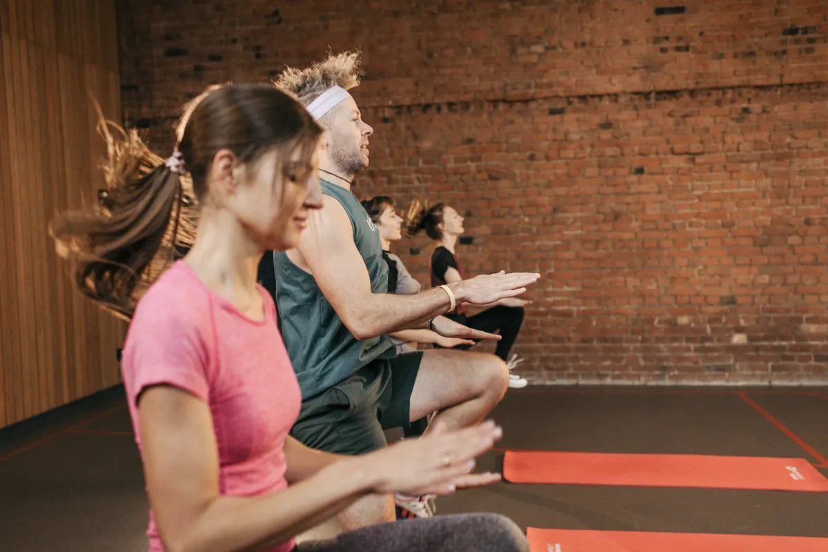 A group class mid-session in a bright studio